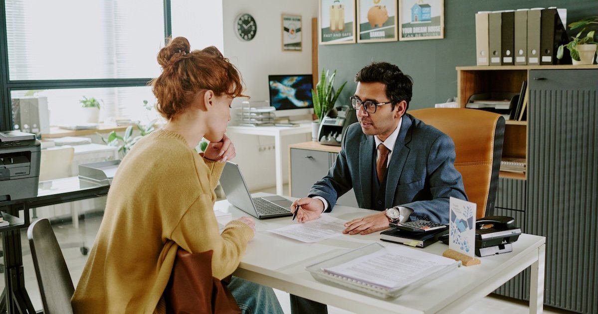 An adviser explaining contract terms and campaign responsibilities to a client